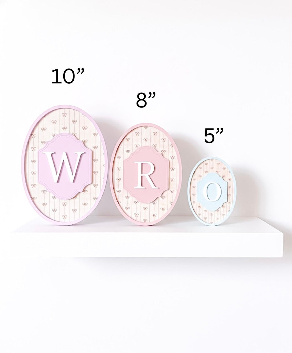 Three decorative letters 'W', 'R', and 'O' with measurements on a white background